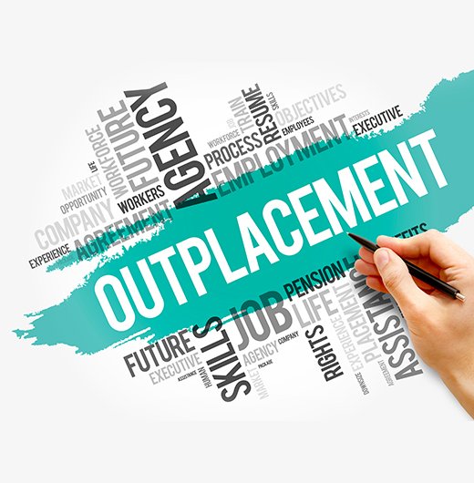 Outplacement Services Featured Image hand holding pen is poised above various terms related to outplacement