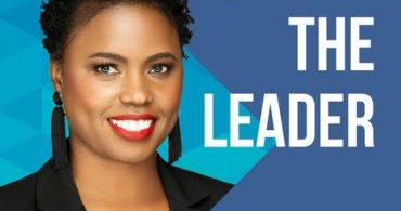 Chanel Christoff Davis stands smiling next to the Follow the Leader podcast logo