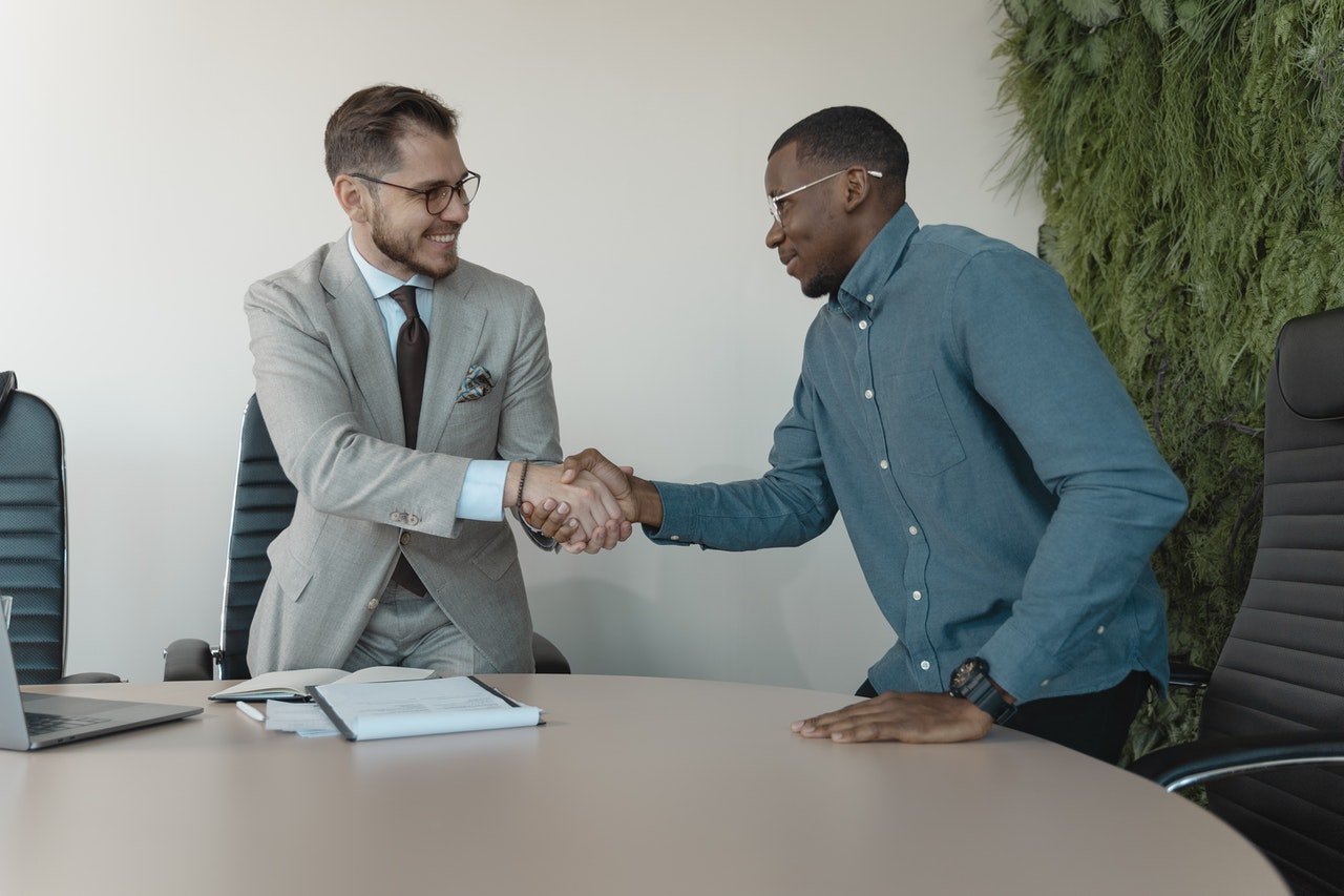two men shaking hands at a job interview