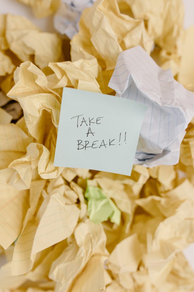 Crumpled paper with a post-it note that says, "Take a break."