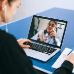 Woman talking to someone on a video call.