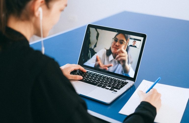 Woman talking to someone on a video call.